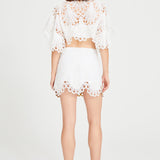 White Lace Mini Skirt With Gold Eyelet Details