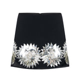 Black Crepe Mini Skirt With Patent Flower Detail
