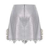 Metallic Knitted Mini Skirt With Patent Feathers