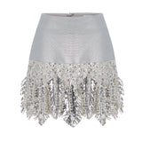 Metallic Knitted Mini Skirt With Patent Feathers