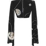 Black Sequined Jersey Top With Patent Flowers And Flare Sleeves
