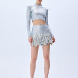 Metallic Knitted Mini Skirt With Patent Feathers