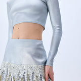 Metallic Knitted Mini Skirt With Patent Feathers