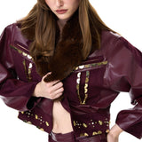 Burgundy Suede Pants With Leather Details And Gold Accessories