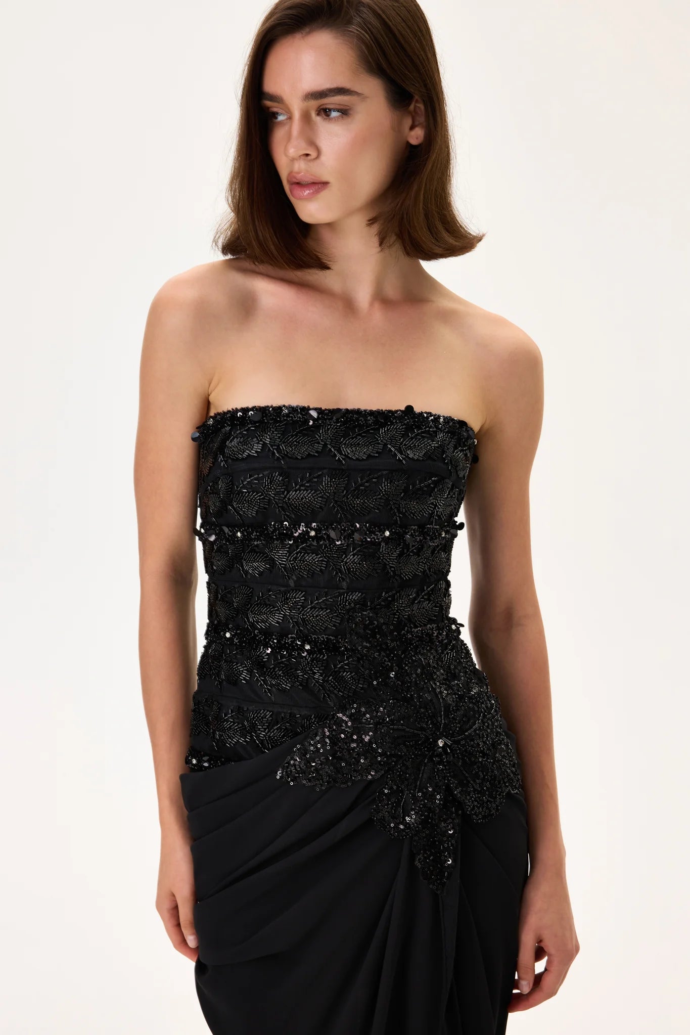 SS26-D-1049-42 raisa_vanessa black-gown-with-beaded-leaf-motive-striped-corset-top-and-fully-embroidered-flower-detail