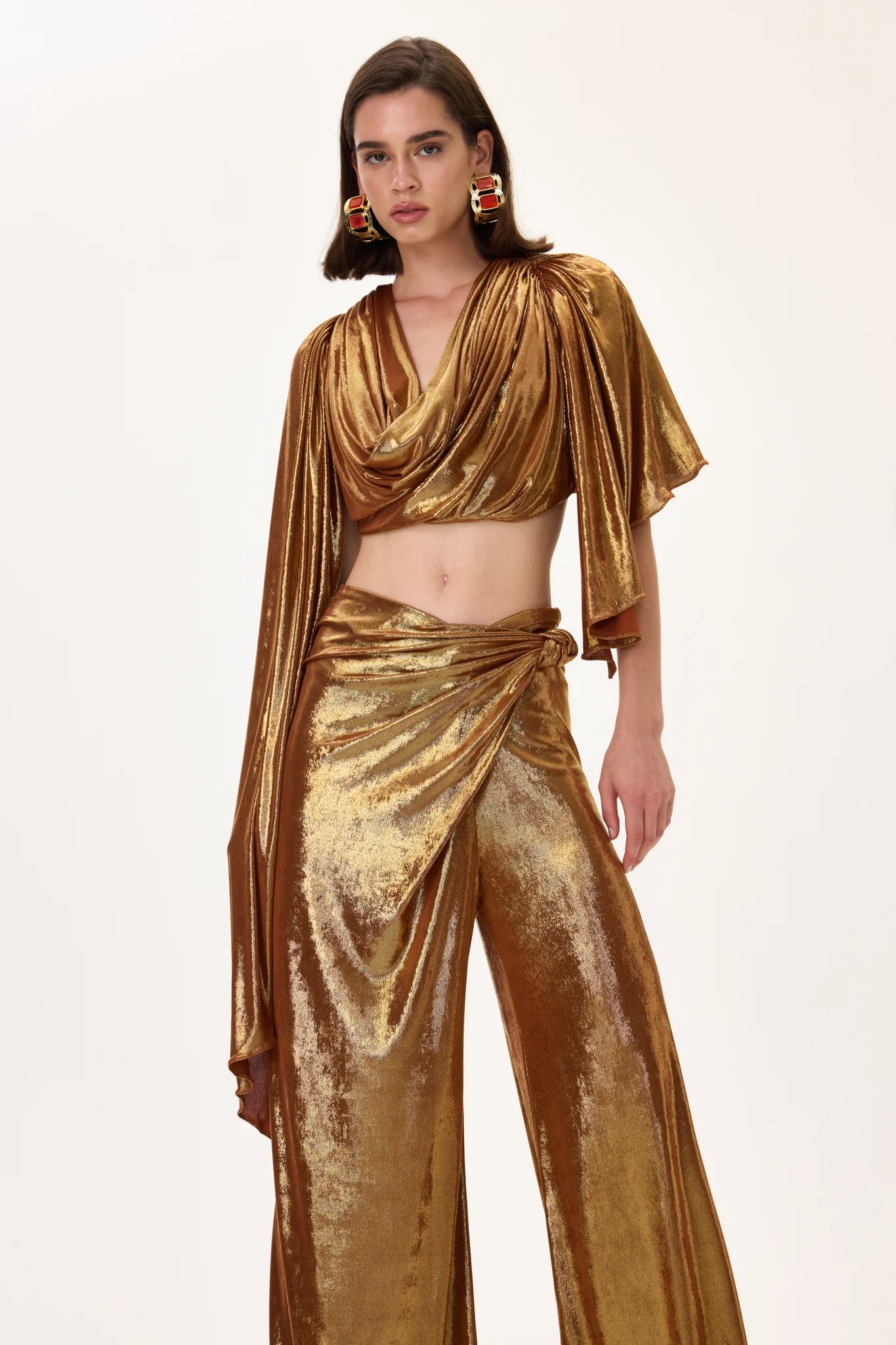 SS26-T-1009-40 raisa_vanessa bronze-metallic-jersey-cowl-neckline-backless-crop-top-with-asymmetrical-sleeves