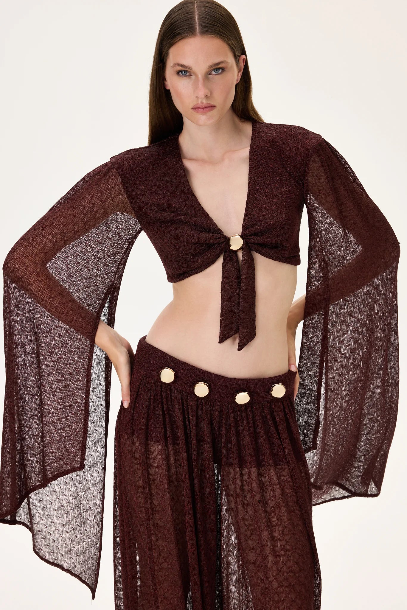 SS26-T-1017-40 raisa_vanessa knitted-burgundy-flare-sleeved-crop-top-with-gold-buckle-and-tie-detail